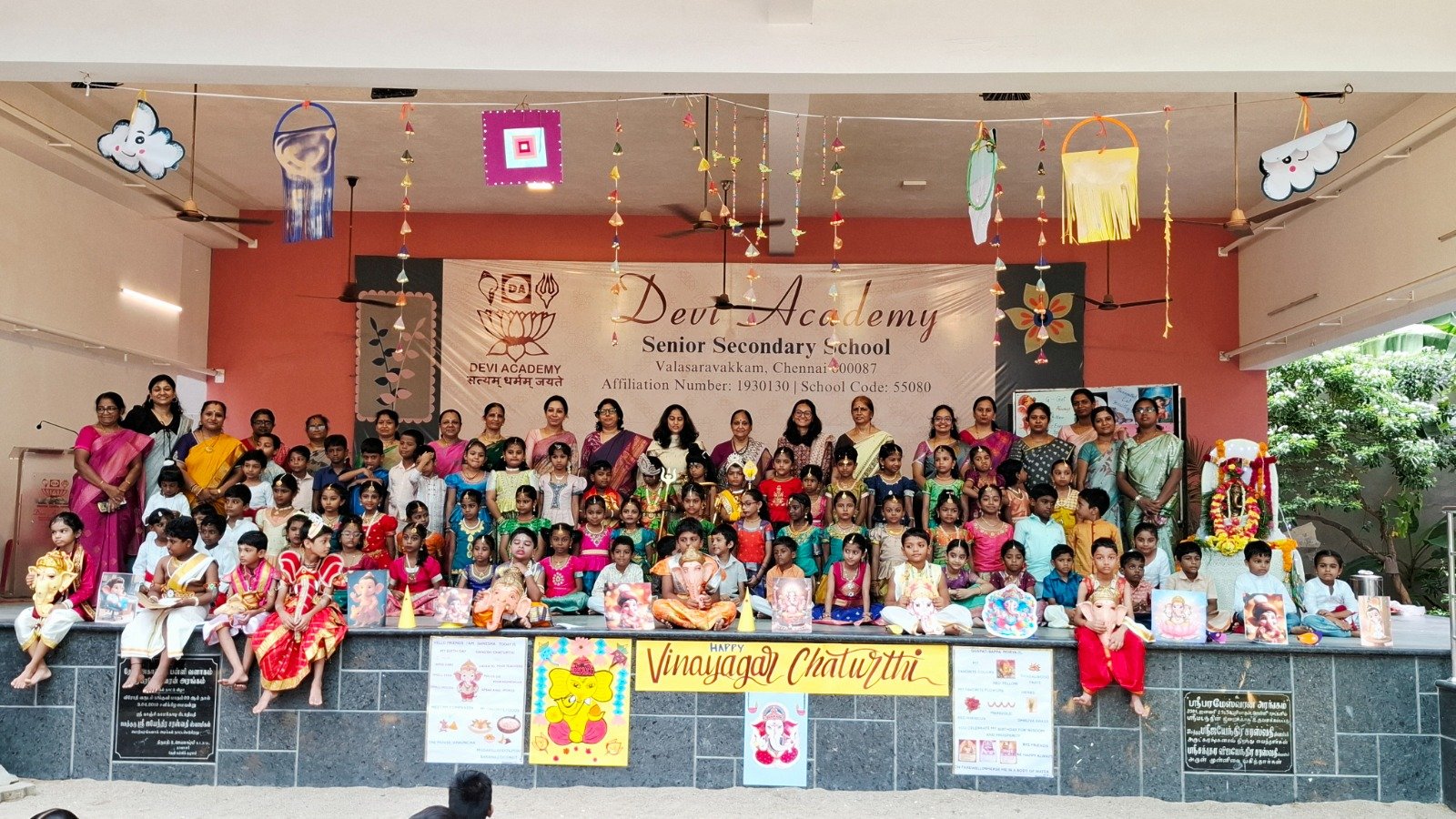 Classes I and II with teachers on stage for Vinayaka Chaturthi at Devi Academy